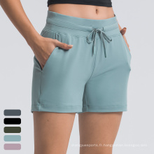 Shorts de course à séchage à séchage Femmes avec shorts de sport de poche short de yoga de fitness athlétique short pour femmes